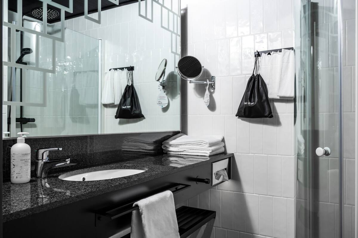 standard twin room (extra bed possibility) | in-room safe, desk, laptop workspace, blackout curtains