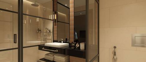 Ein modernes Badezimmer mit einer begehbaren Glasdusche, einem Waschtisch und einer Toilette.