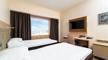 Desk, laptop workspace, blackout drapes, iron/ironing board