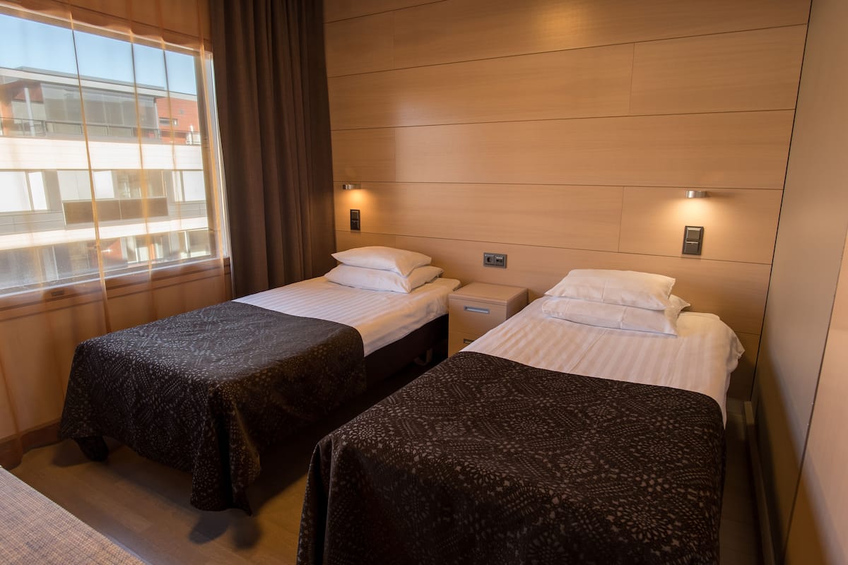 desk, laptop workspace, blackout curtains, iron/ironing board