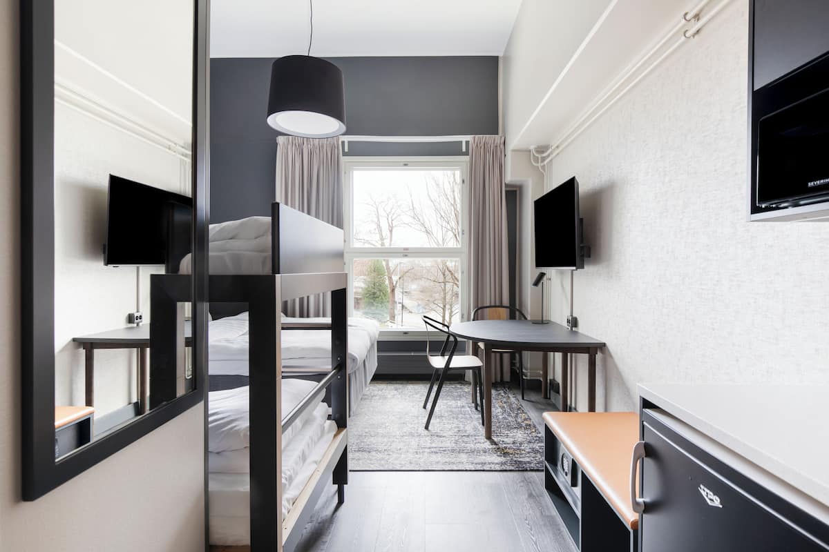 family room (standard) | in-room safe, desk, laptop workspace, iron/ironing board