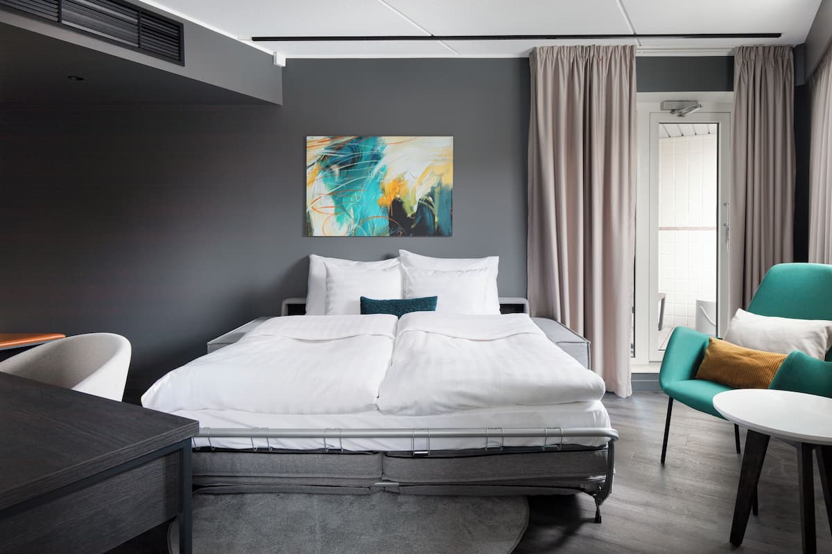 junior suite, 1 king bed (two extra beds possible) | in-room safe, desk, laptop workspace, iron/ironing board