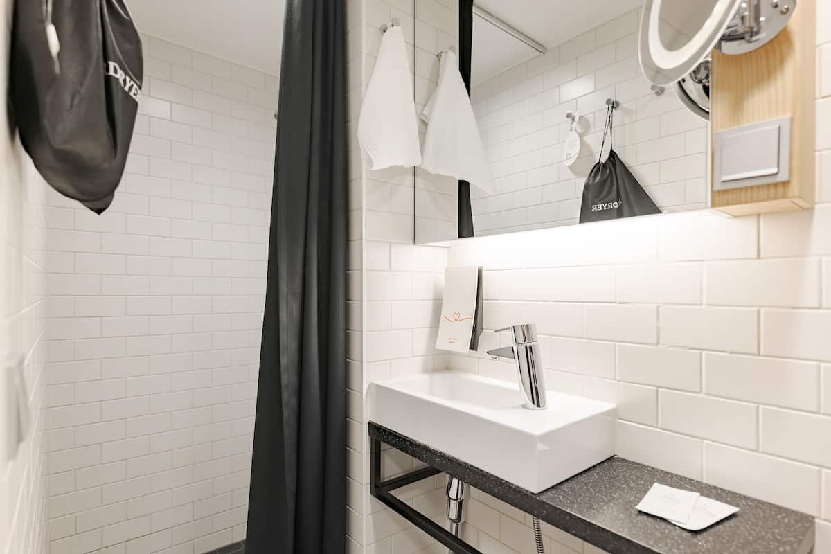 superior room | bathroom | shower, hair dryer, towels