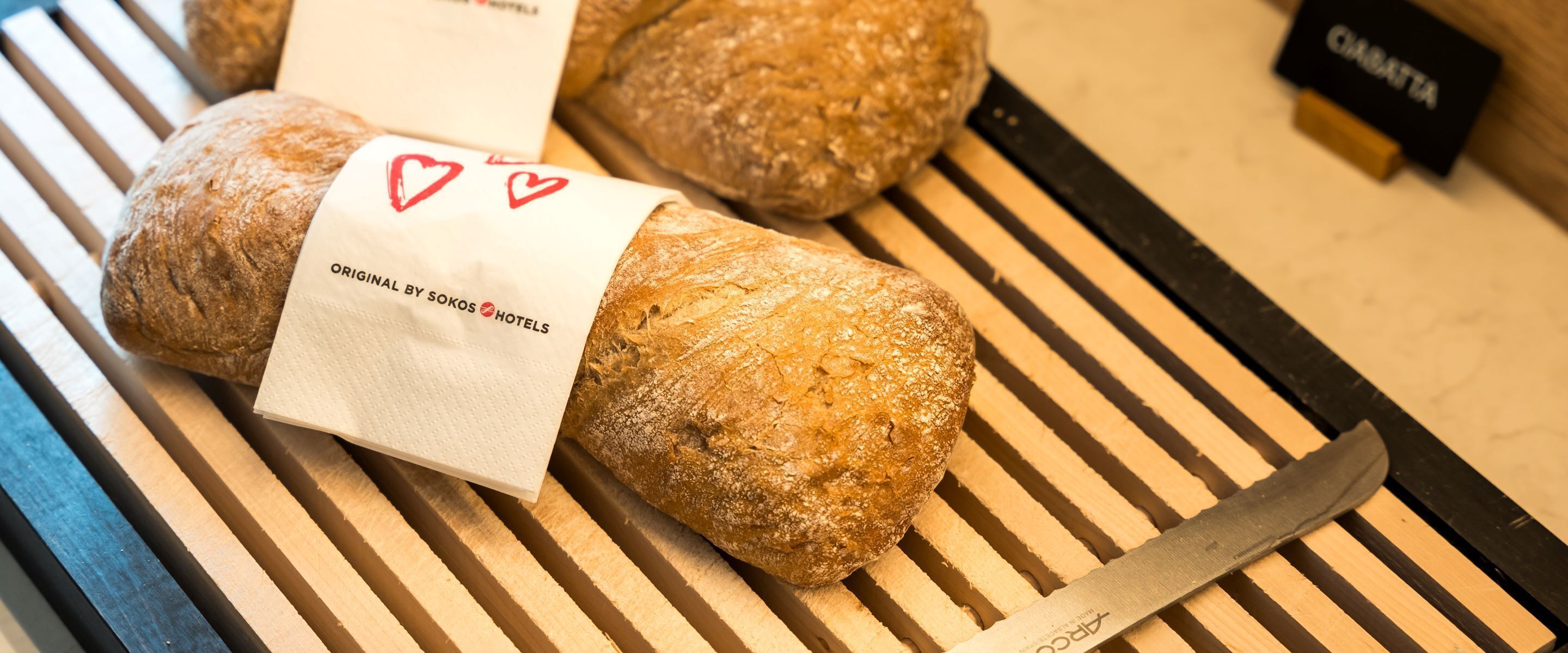 A loaf of bread with a tag labeled "Original by Sokos Hotel."