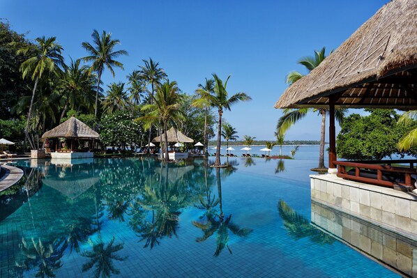 Outdoor pool, open 7:00 AM to 7:00 PM, free cabanas, pool umbrellas