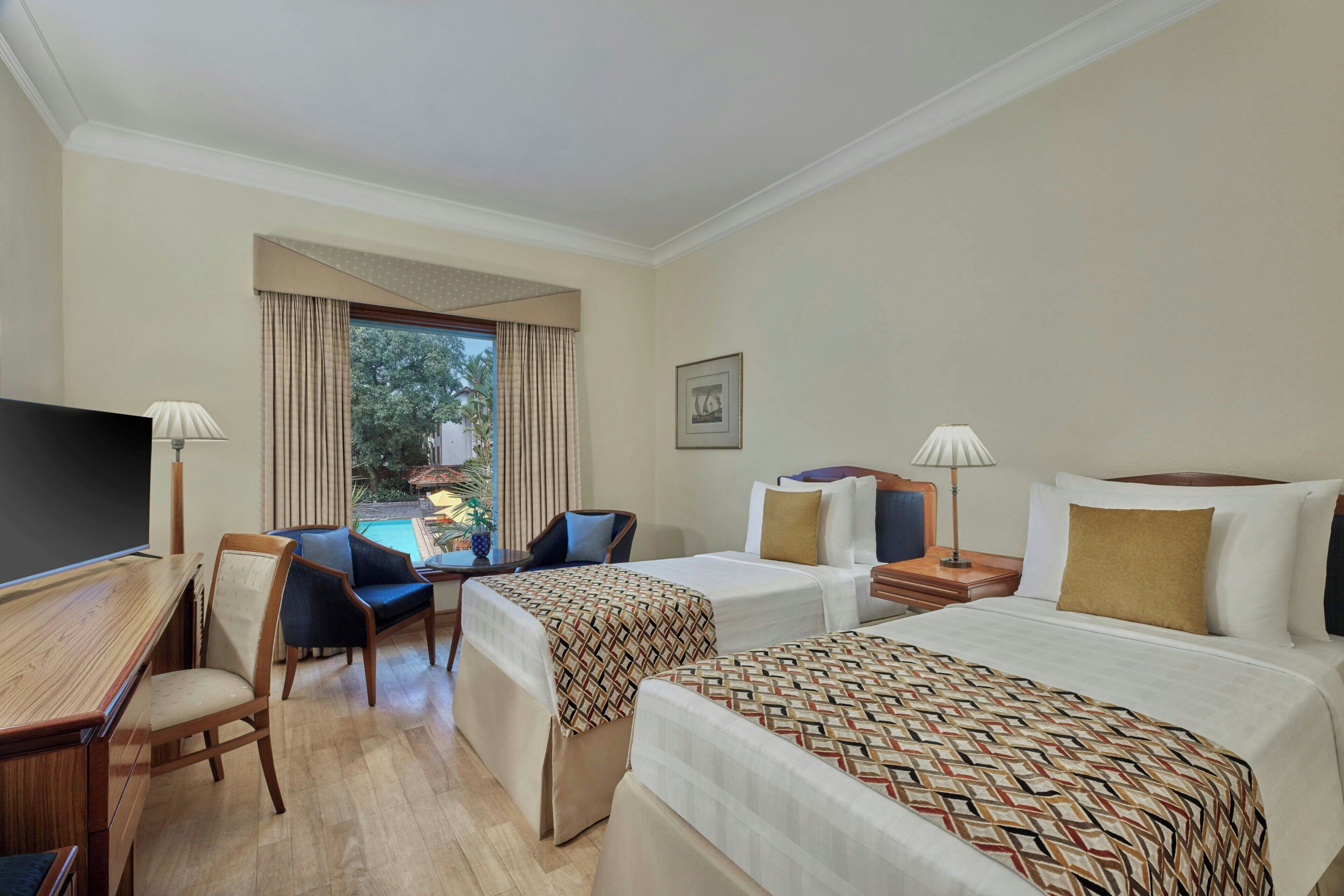 Habitación clásica, 2 camas individuales, vistas a la piscina | Piscina | Una piscina al aire libre