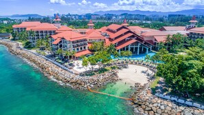 A resort with multiple buildings, a beach, and a pool area. - The Magellan Sutera Resort (Kota Kinabalu)
