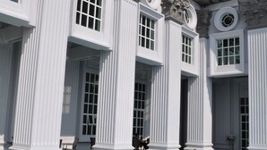 A large building with a swimming pool, columns, and a balcony. - Grand Swiss-Belhotel Melaka (Malacca City)