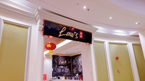 A reception area with a sign reading "Law's" and a counter with various items. - Grand Swiss-Belhotel Melaka (Malacca City)
