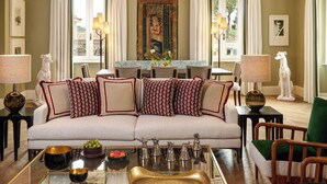 A living room with a sofa, a coffee table, and decorative items.