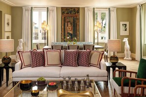 A living room with a sofa, a coffee table, and decorative items.