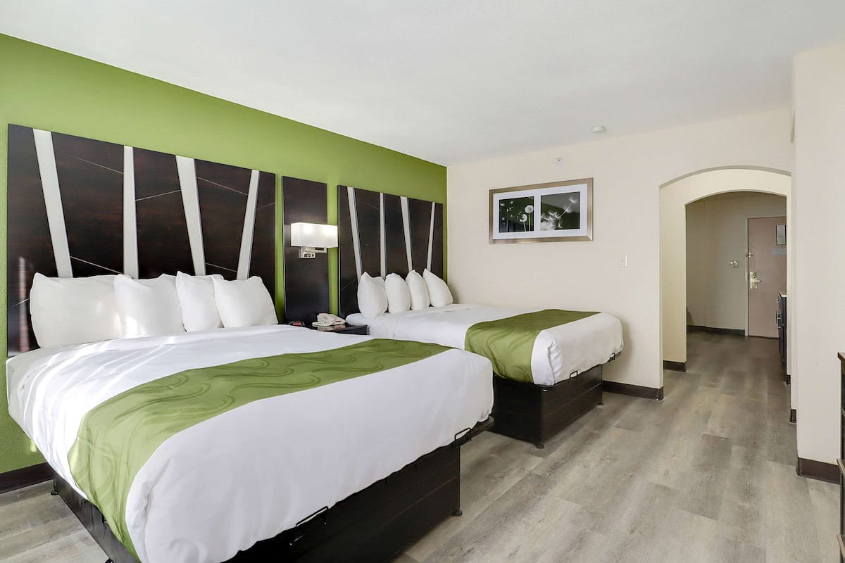 Suite Two Queens Non Smoking | In-room safe, desk, iron/ironing board, free cribs/infant beds