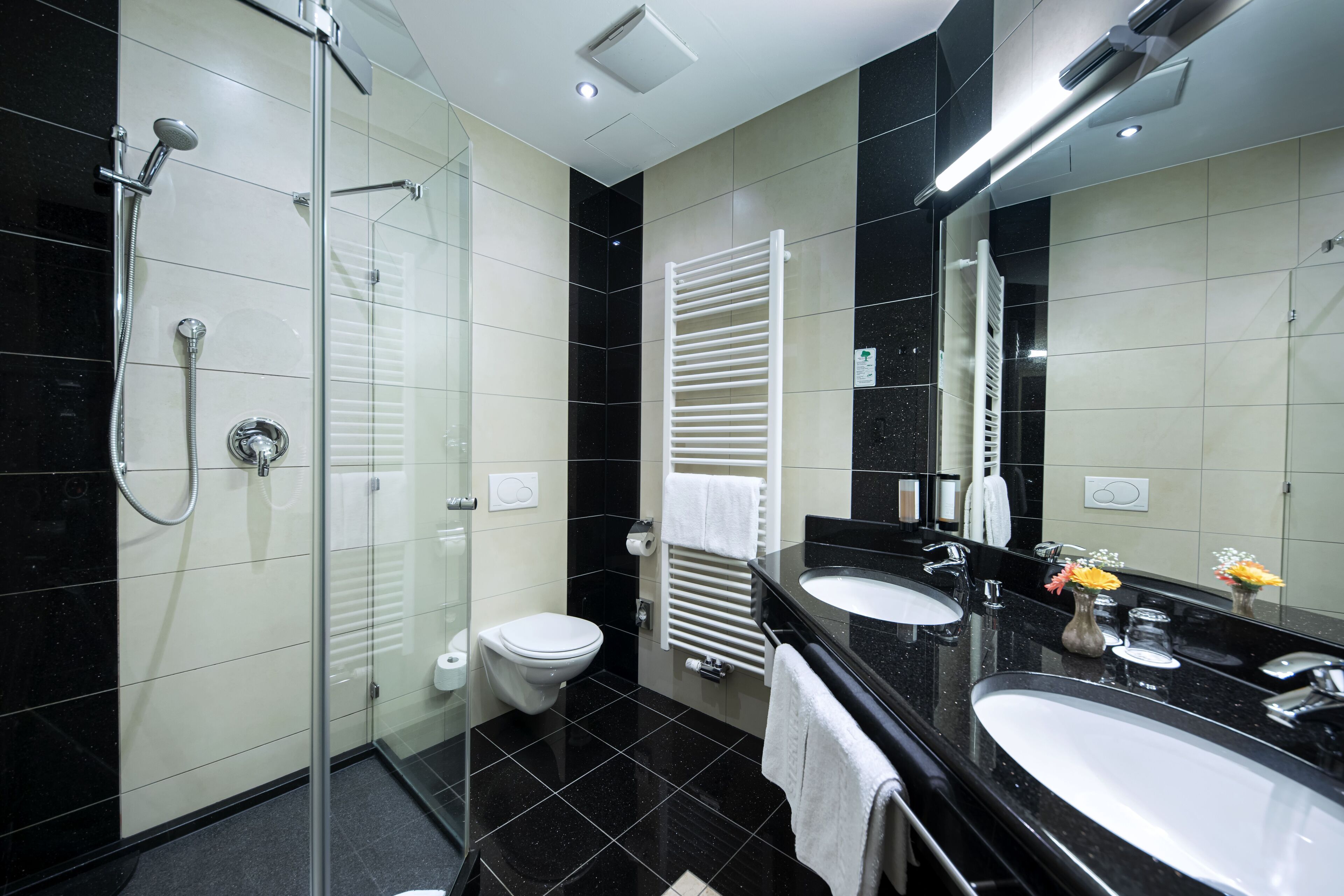 junior suite | bathroom | eco-friendly toiletries, hair dryer, towels