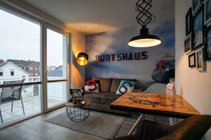Apartment (Bootshaus Deck 5) | Living area | Flat-screen TV, tablet