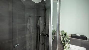 Shower, eco-friendly toiletries, hair dryer, towels