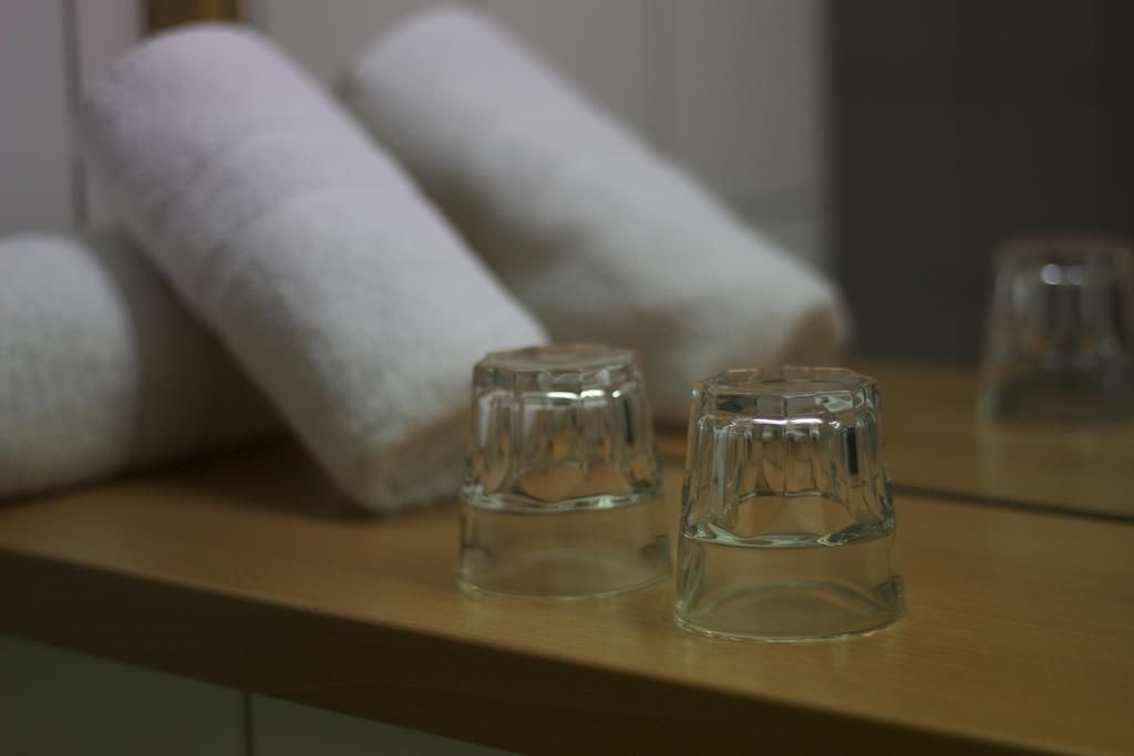 standard double room single use | bathroom | shower, hair dryer, towels