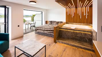 Premium Suite, Bathtub | Living area | 32-inch Smart TV with cable channels, Netflix, streaming services