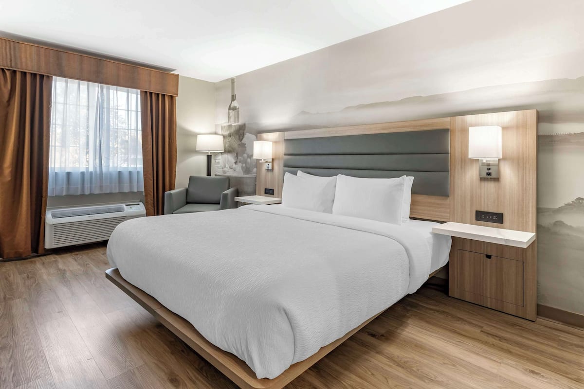 Desk, laptop workspace, blackout curtains, iron/ironing board