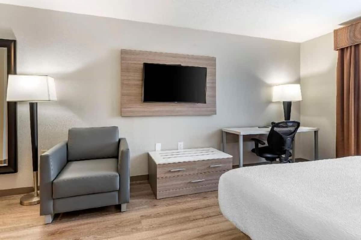 Desk, laptop workspace, blackout drapes, iron/ironing board