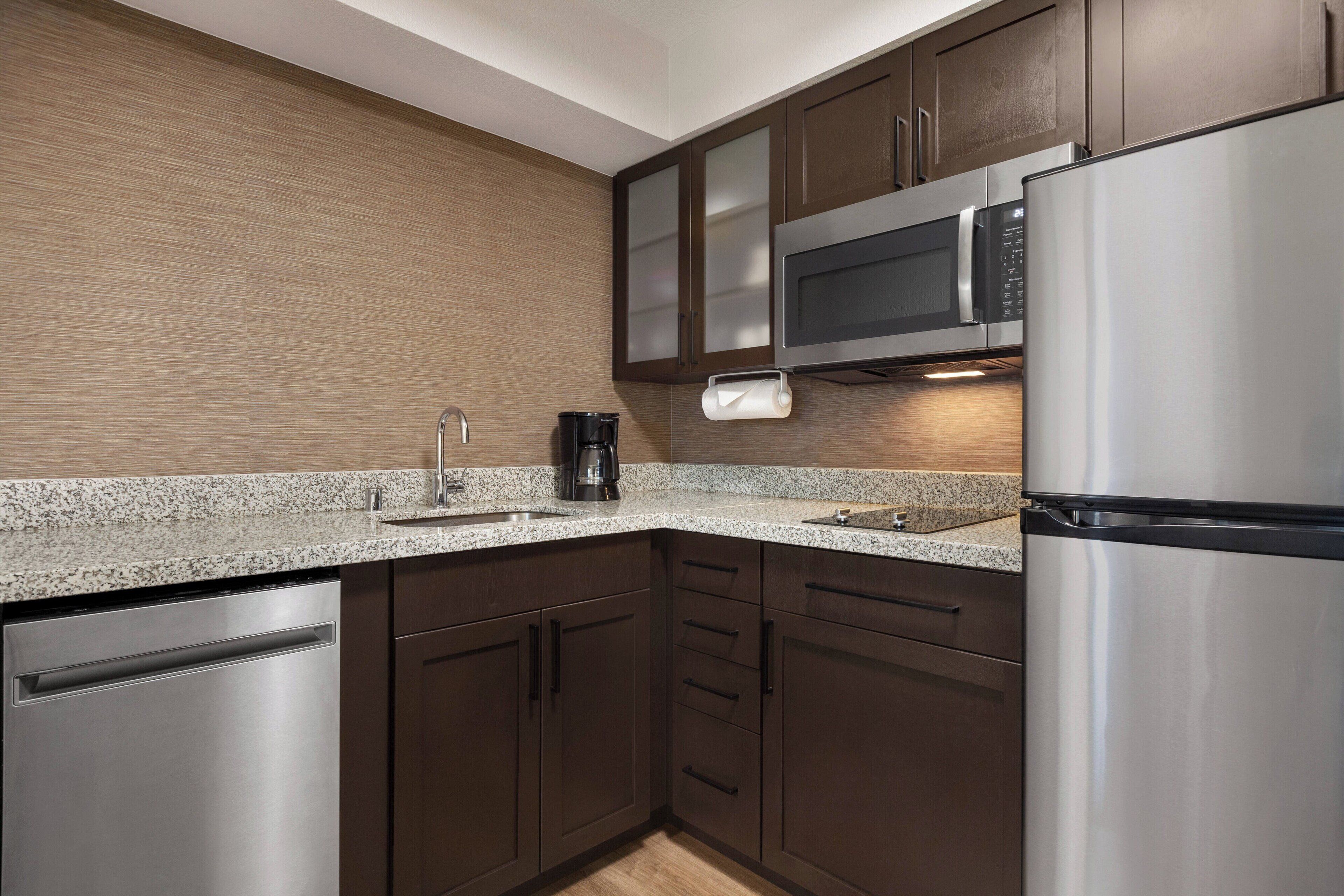 full-sized fridge, microwave, stovetop, dishwasher