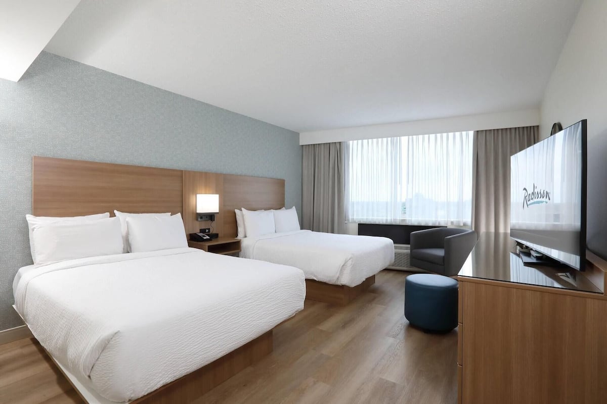 Premium bedding, pillowtop beds, desk, blackout drapes