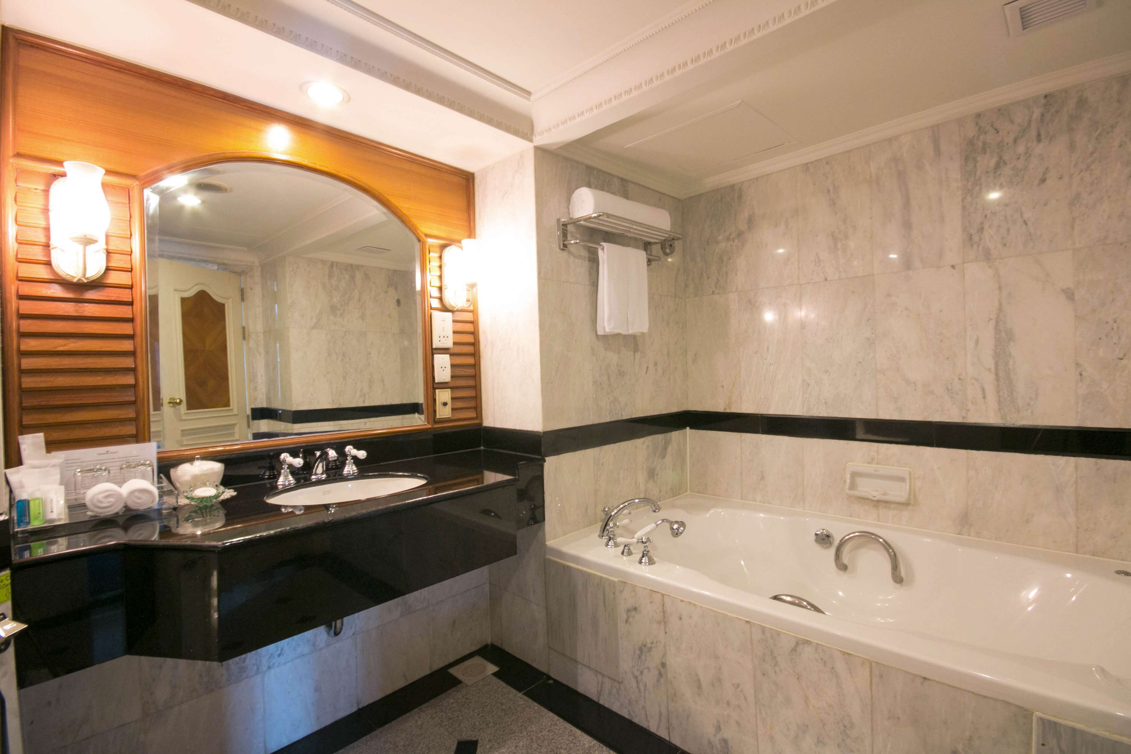 grand suite, multiple beds | bathroom | separate bathtub and shower, deep-soaking bathtub