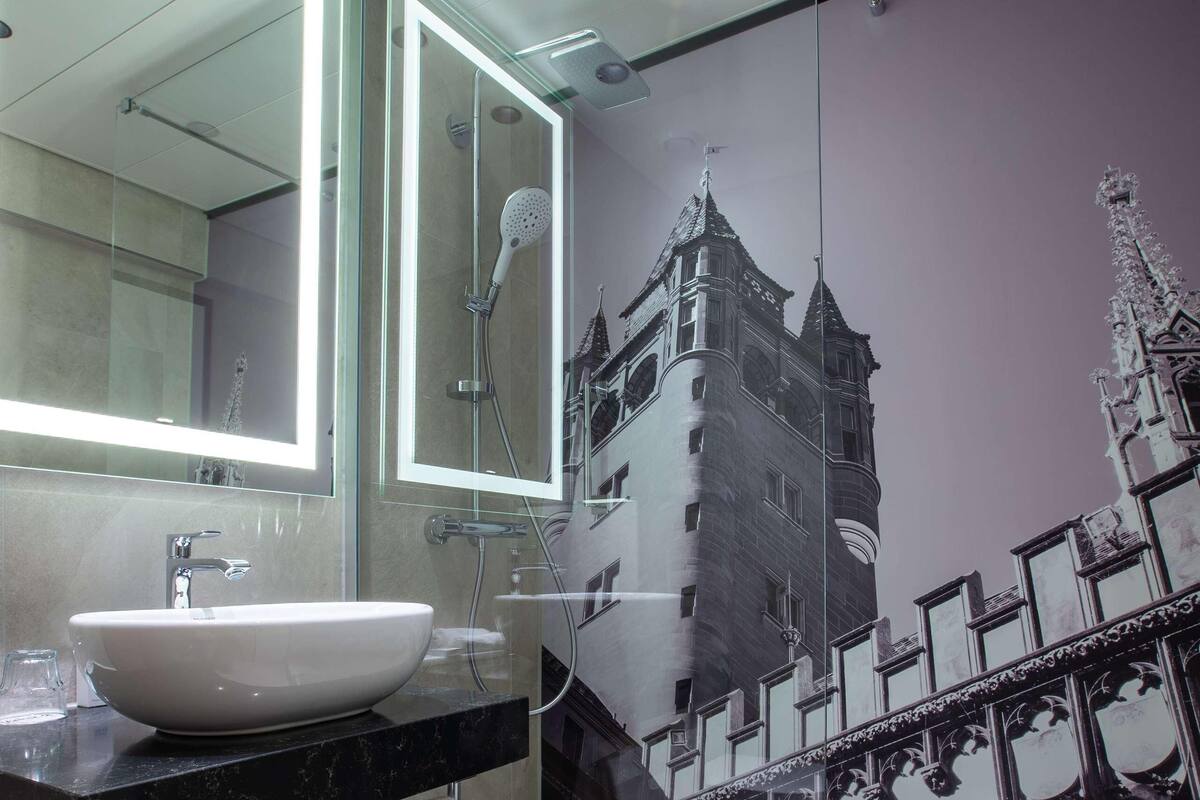 Bathroom | Rainfall showerhead, eco-friendly toiletries, hair dryer, towels