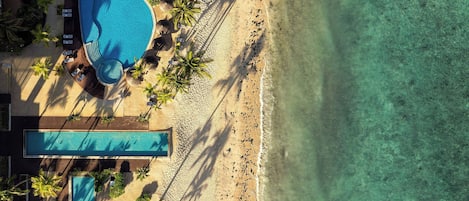 2 outdoor pools, an infinity pool, pool umbrellas