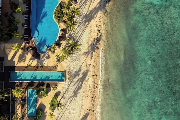 2 outdoor pools, an infinity pool, pool umbrellas