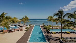 2 outdoor pools, an infinity pool, pool umbrellas