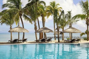 2 outdoor pools, an infinity pool, pool umbrellas