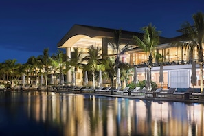 2 outdoor pools, an infinity pool, pool umbrellas