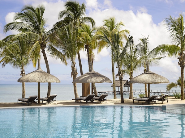 2 outdoor pools, an infinity pool, pool umbrellas