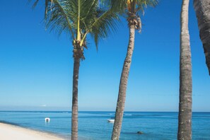 Private beach, white sand, sun-loungers, beach umbrellas
