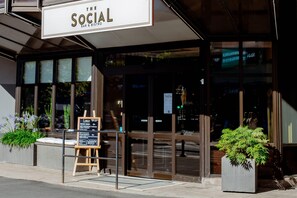A storefront with a sign reading 'The Social Bar & Bistro' and a menu board outside. - Quality Hotel Royal Corner (Växjö)