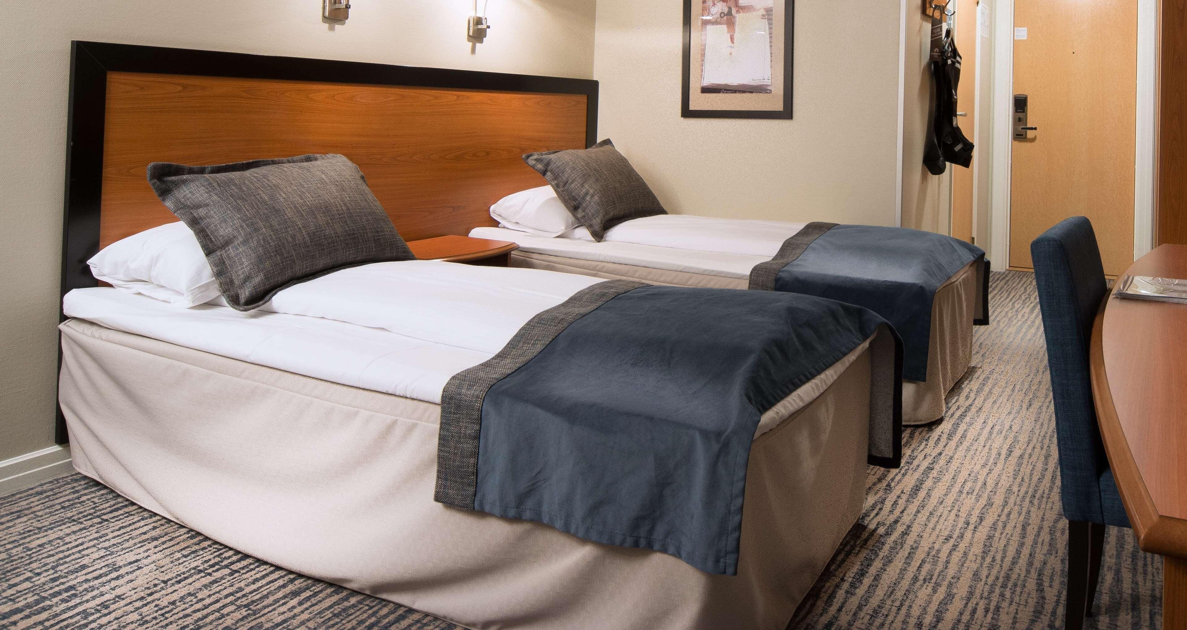Pillowtop beds, desk, blackout drapes, iron/ironing board