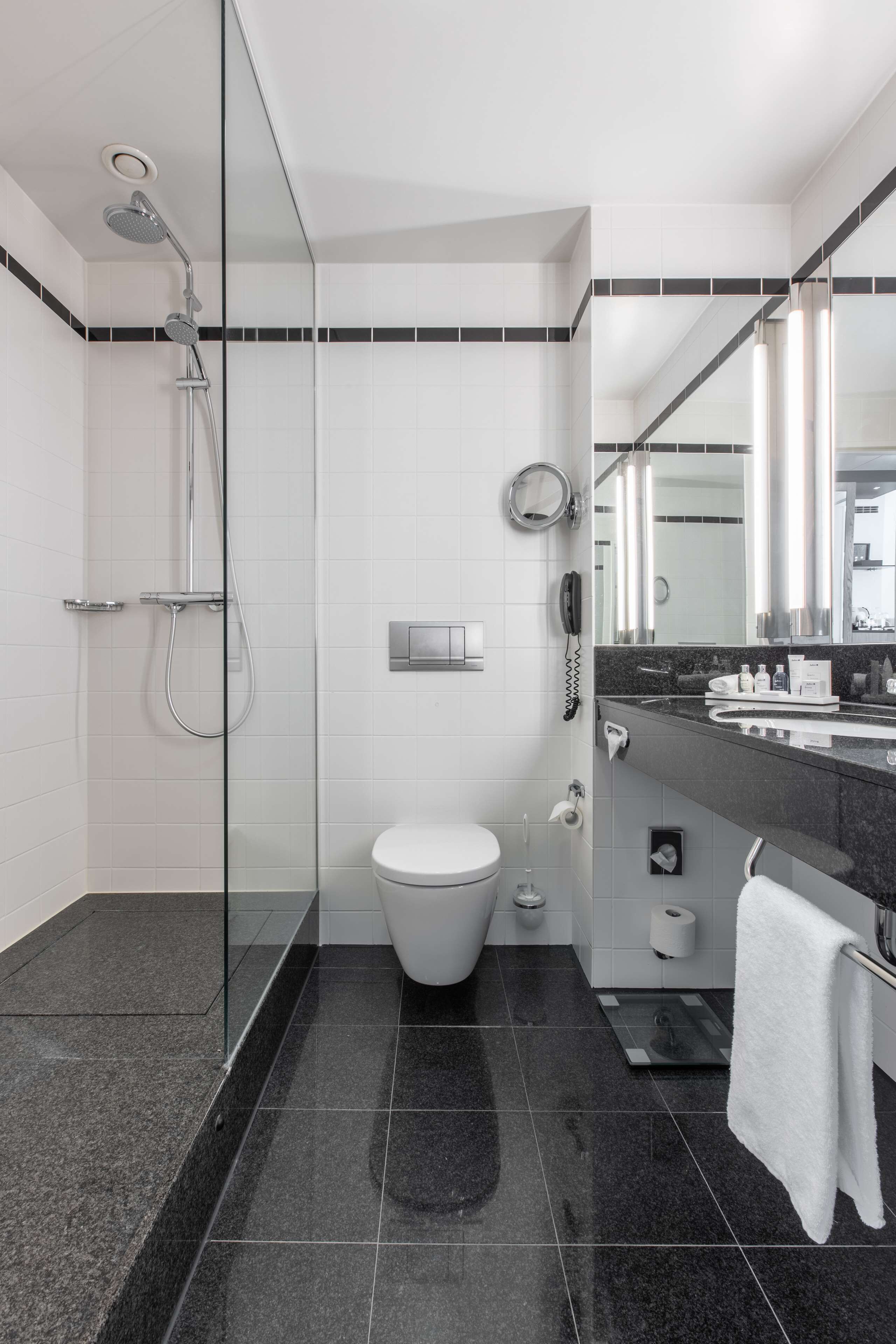 combined shower/bathtub, designer toiletries, hair dryer, slippers