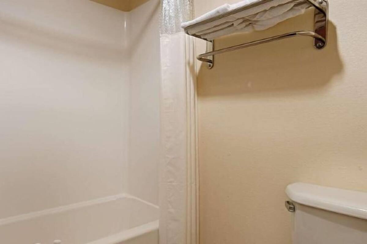 Combined shower/bathtub, hair dryer, towels, soap