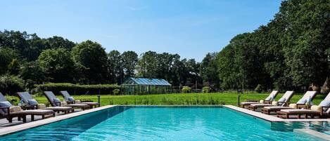 Indoor pool, outdoor pool, pool umbrellas, pool loungers