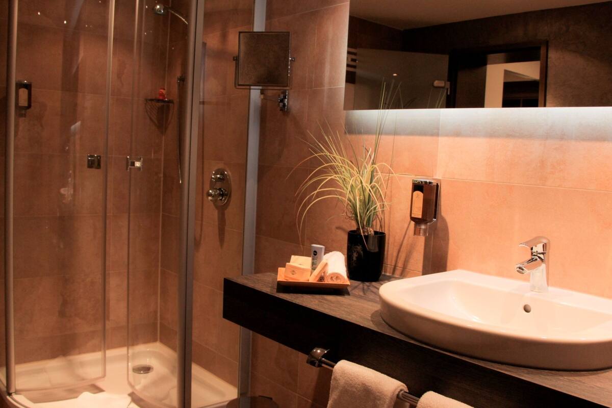 classic double room | bathroom | hair dryer, bathrobes, slippers, towels