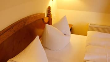 Desk, iron/ironing board, bed sheets