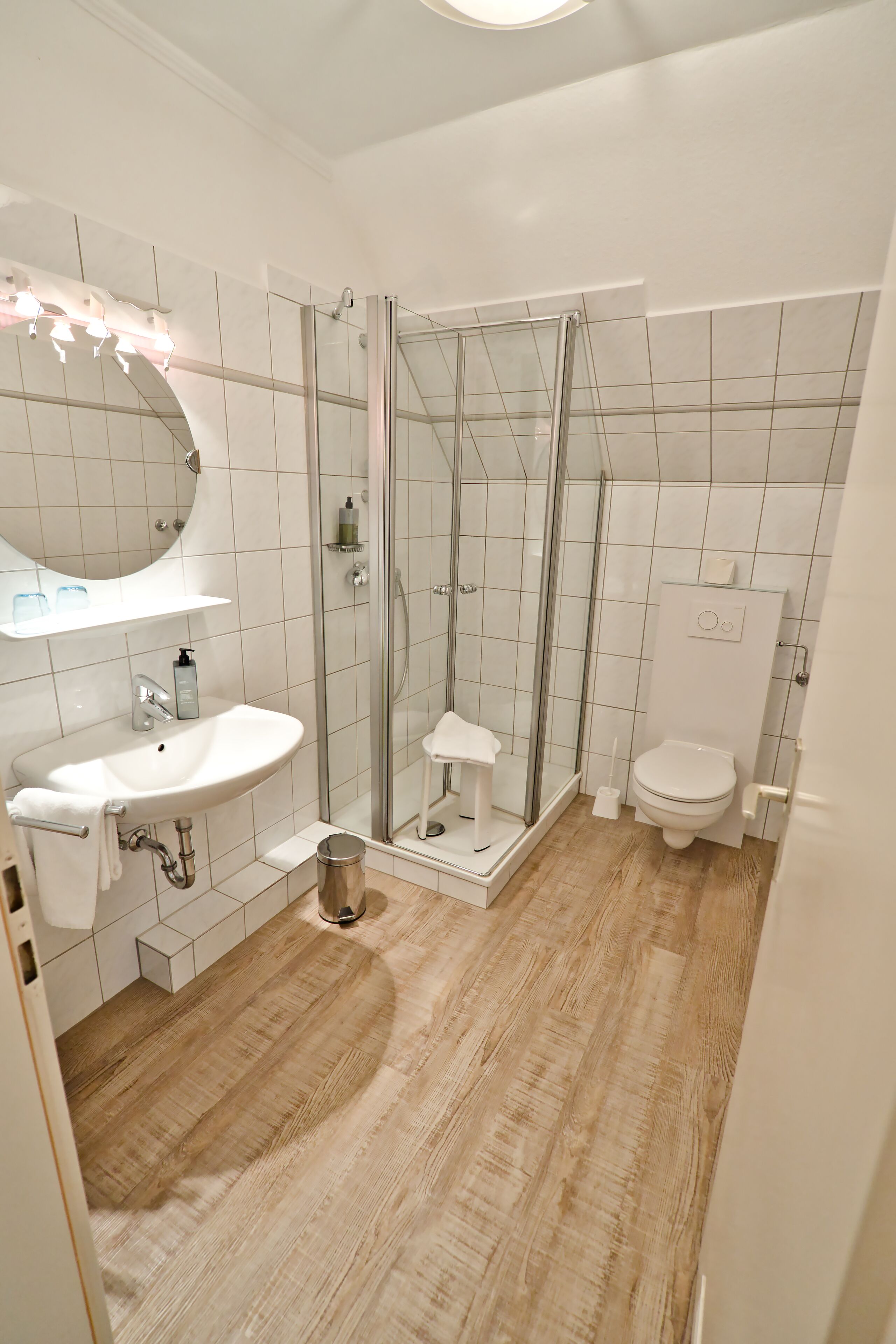 hair dryer, bathrobes, slippers, towels