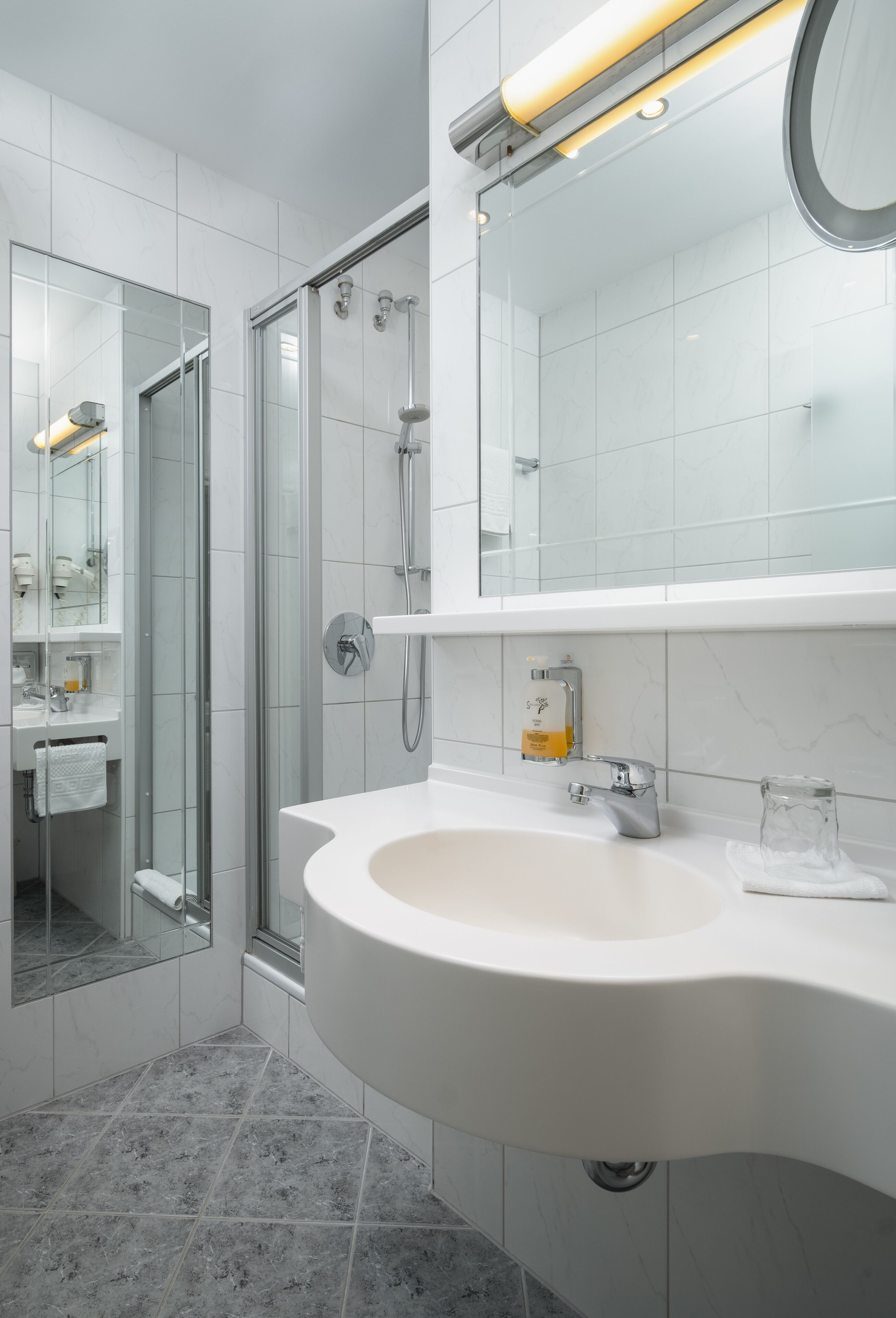 classic single room | bathroom | shower, hair dryer, bathrobes, towels
