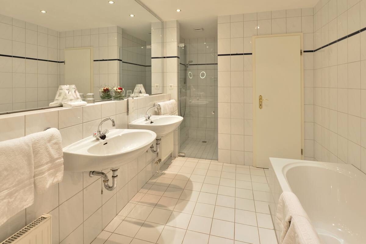 superior double room | bathroom | shower, hair dryer, bathrobes, slippers