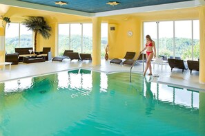 Indoor pool, open 7 AM to 10 PM, pool loungers