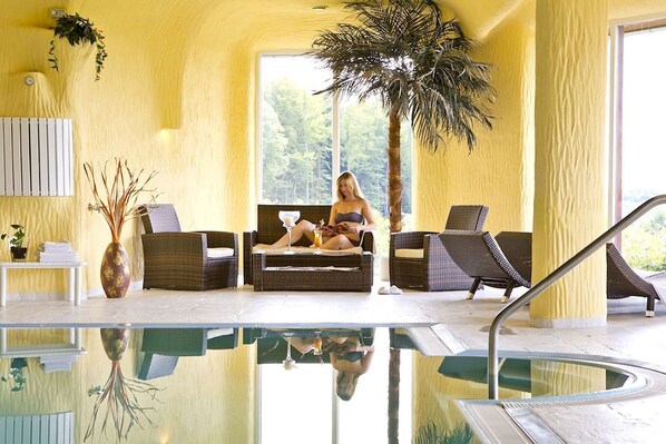 Indoor pool, open 7 AM to 10 PM, pool loungers