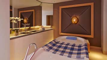 Bathroom features a bathtub, sink, and large mirror.
