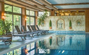 Indoor pool, open 7:00 AM to 10:00 PM, pool umbrellas, pool loungers