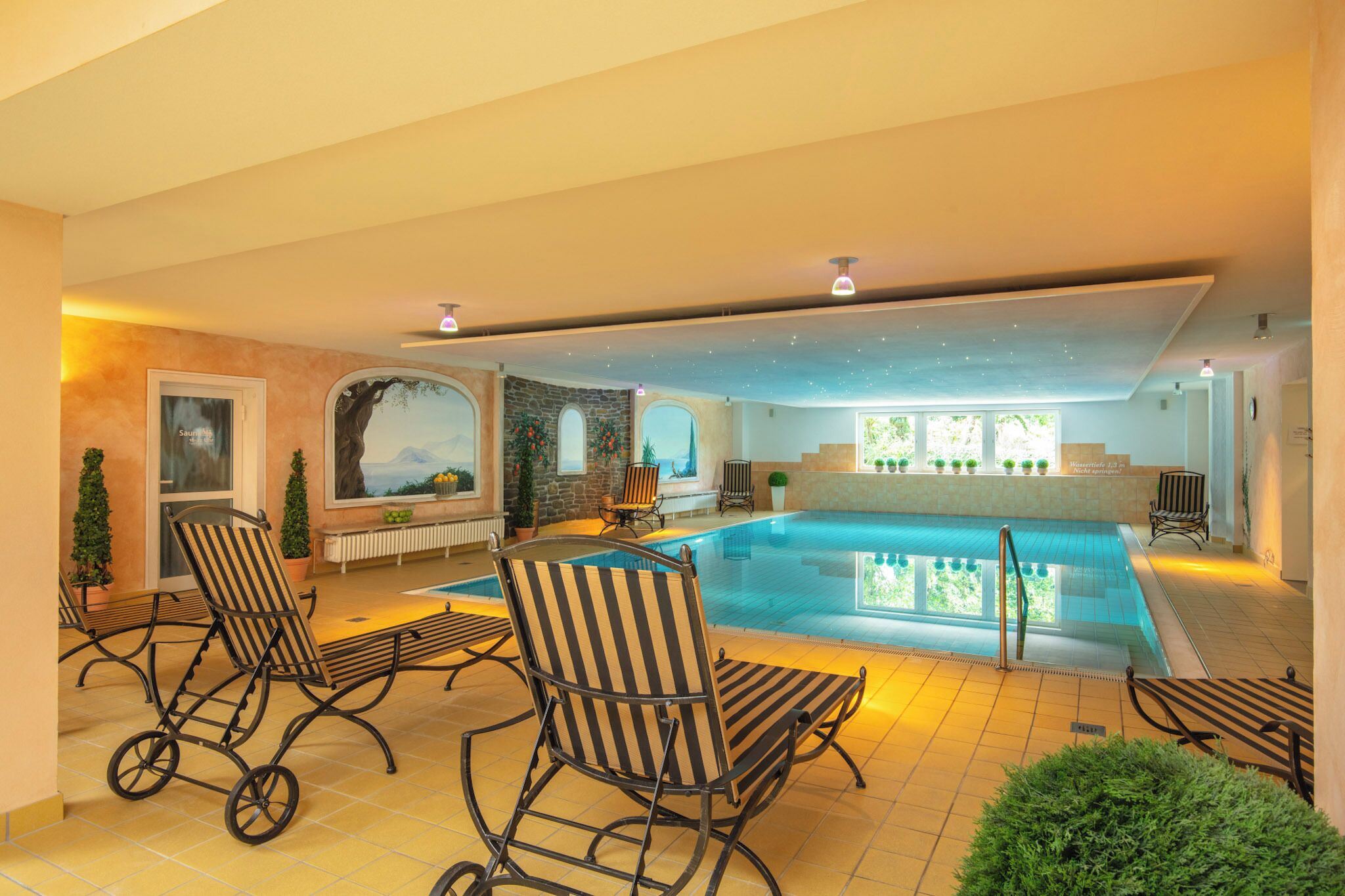 indoor pool, open 7:00 am to 10:00 pm, pool loungers