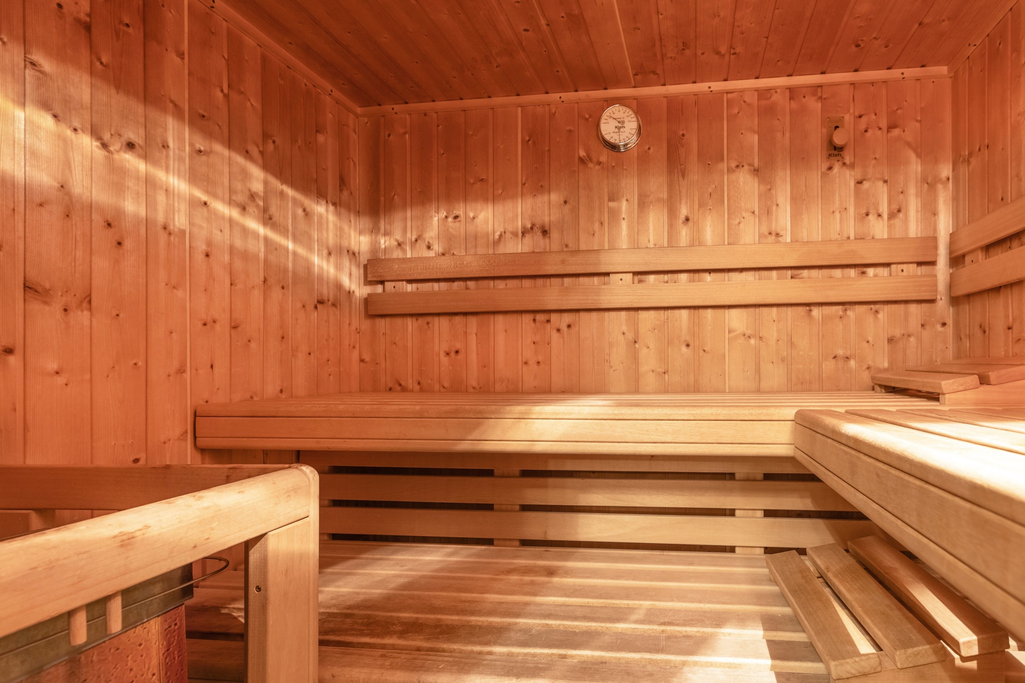 A sauna with wooden walls and benches.